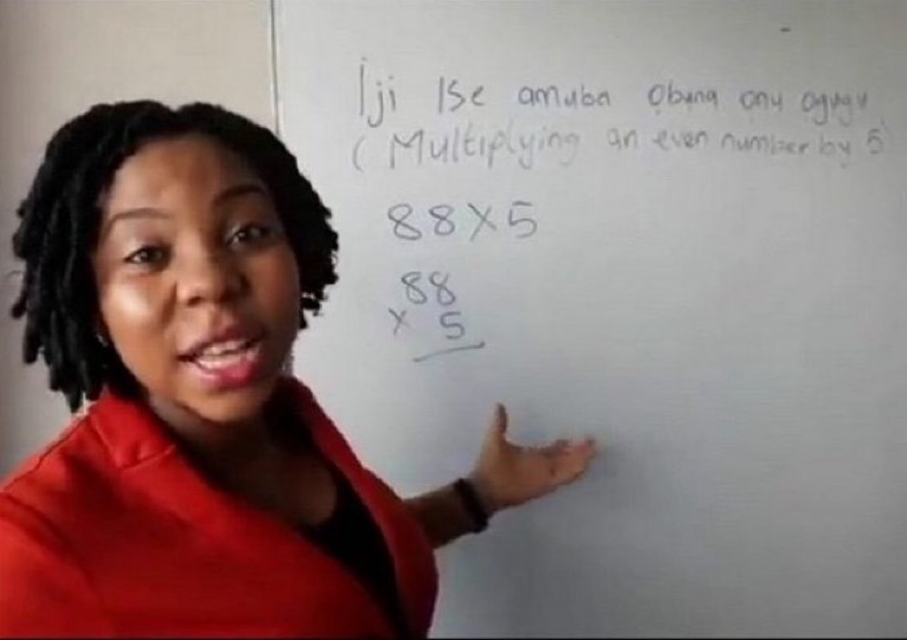 Netiziens celebrate woman who teaches dropout kids maths in Igbo, Pidgin