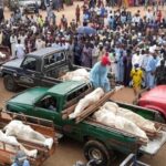 Christian funeral procession in Nigeria after mass killing, highlighting global silence on religious persecution.